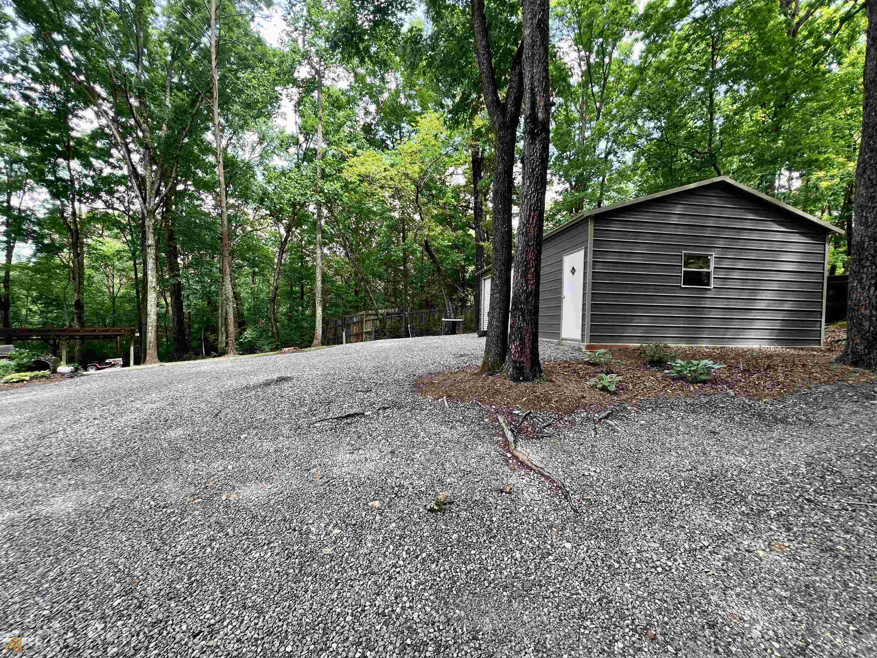 186 Holly Lane Cleveland, GA 30528 - Photo 52 of 58 a view of a house with large trees and large tree