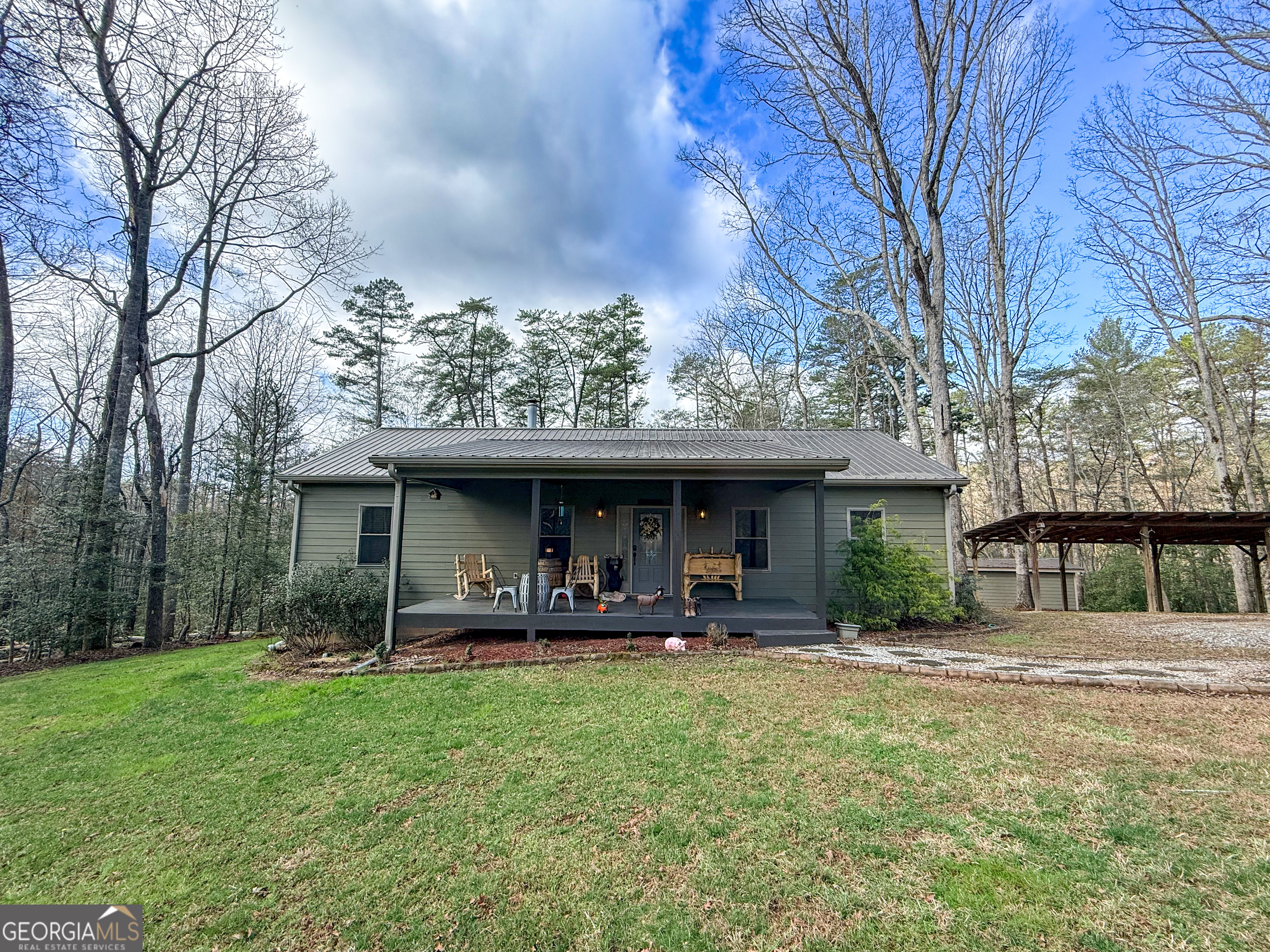 186 Holly Lane Cleveland, GA 30528 - Photo 53 of 58 a view of a house with a yard and sitting area