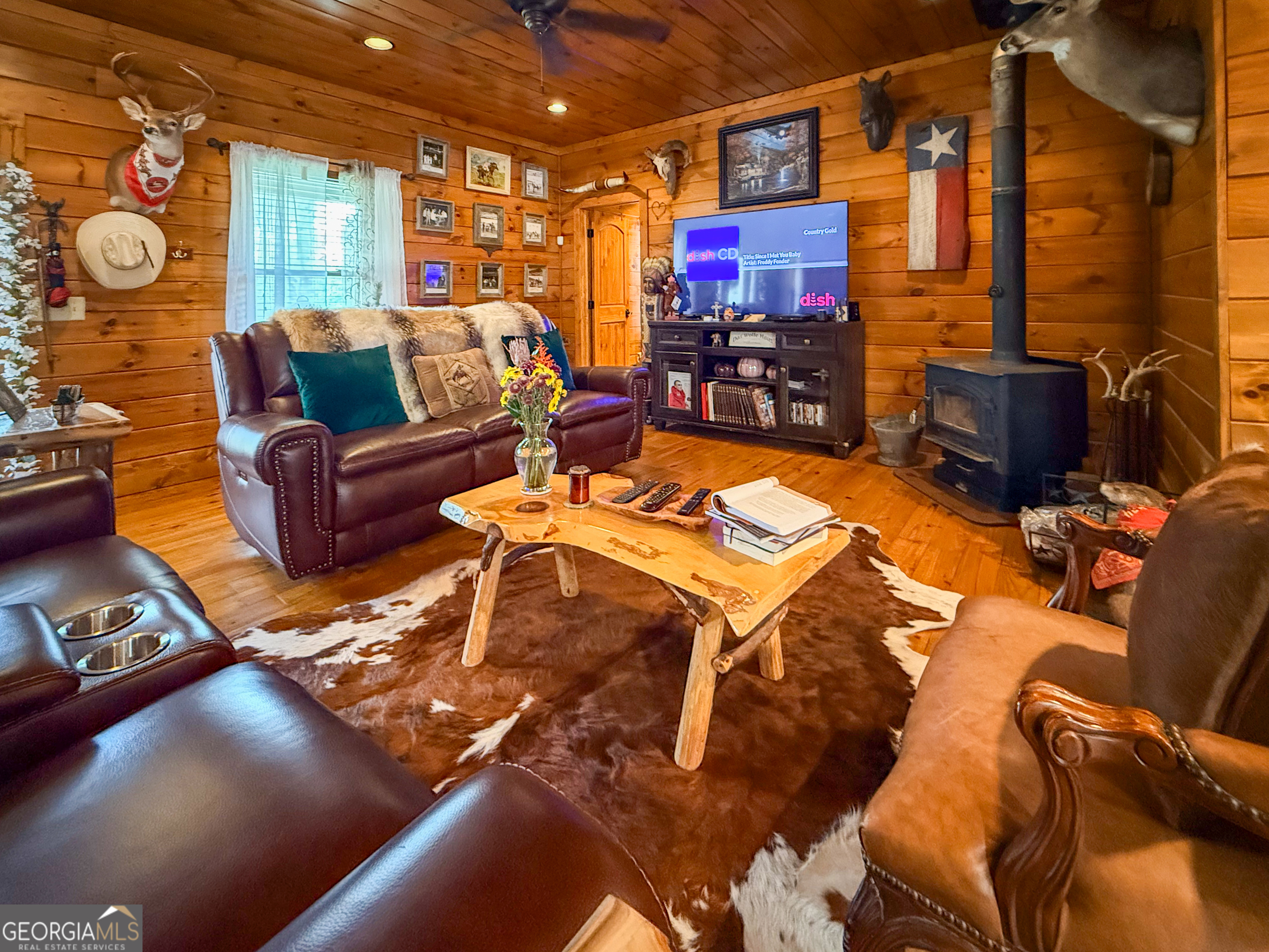186 Holly Lane Cleveland, GA 30528 - Photo 6 of 58 a living room with furniture and a fireplace