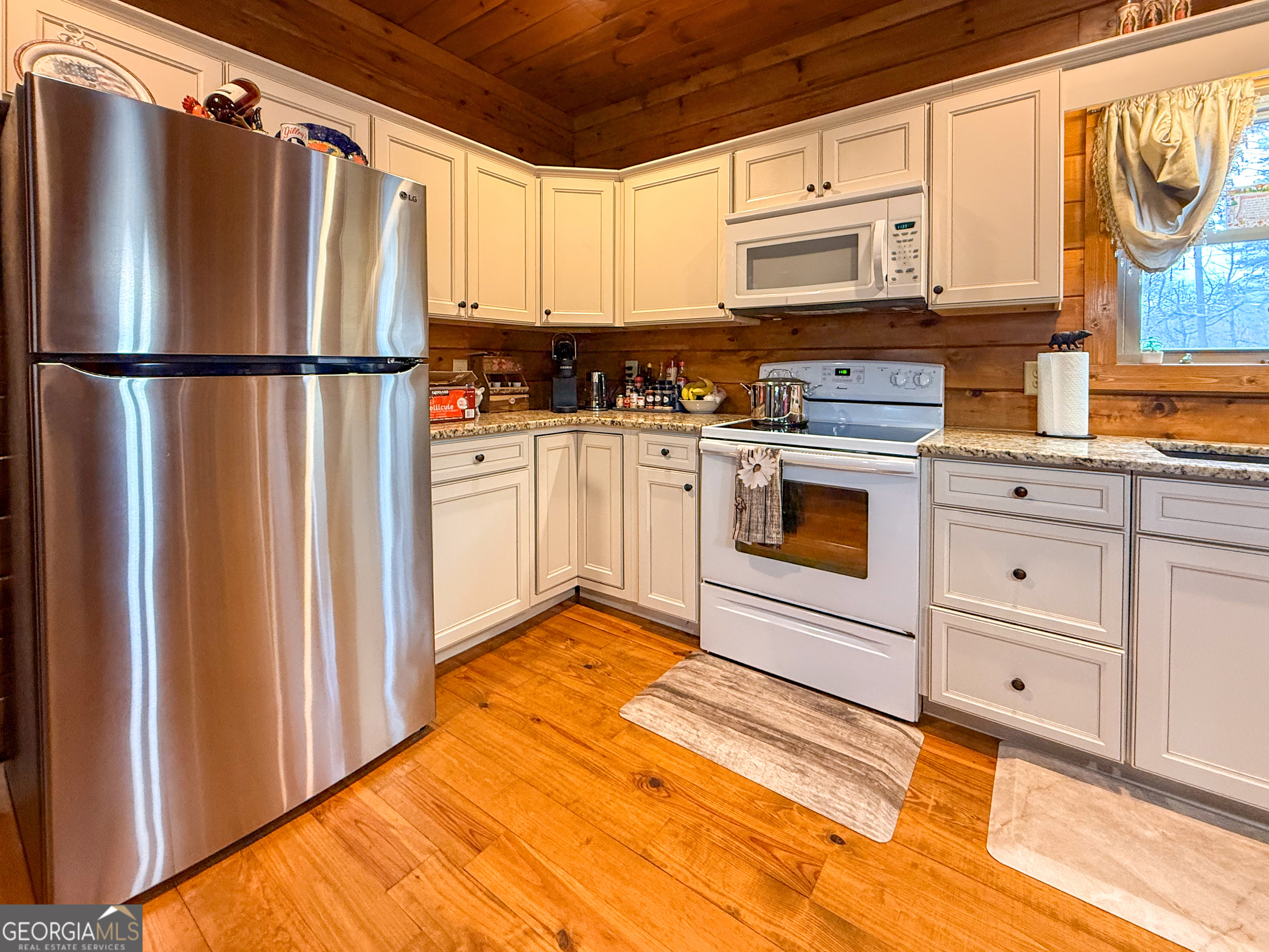 186 Holly Lane Cleveland, GA 30528 - Photo 8 of 58 a kitchen with stainless steel appliances granite countertop a refrigerator sink and cabinets