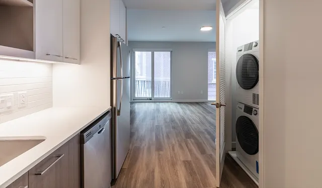 a view of hallway with washer and dryer