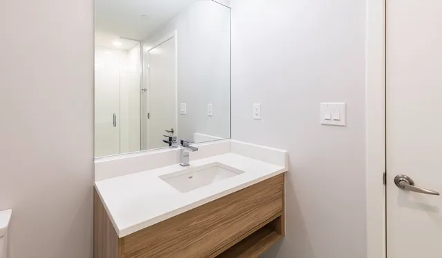 a bathroom with a sink and a mirror