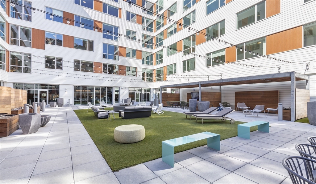50 Rogers Street, Unit 415 Cambridge, MA 02142 - Photo 9 of 15 a view of a swimming pool with outdoor seating