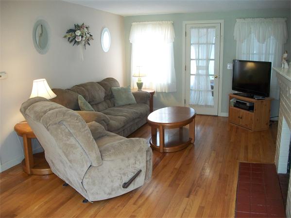 398 Plumtree Road Springfield, MA 01118 - Photo 3 of 24 a living room with furniture and a flat screen tv