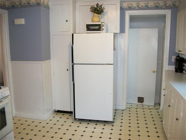 398 Plumtree Road Springfield, MA 01118 - Photo 6 of 24 a white refrigerator freezer sitting inside of a kitchen