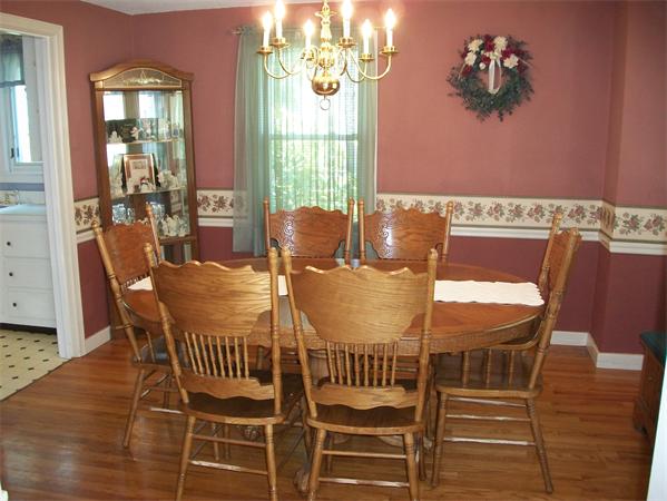 398 Plumtree Road Springfield, MA 01118 - Photo 8 of 24 a view of a dining room with furniture wooden floor and chandelier
