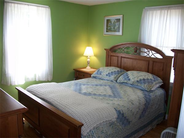 398 Plumtree Road Springfield, MA 01118 - Photo 9 of 24 a bedroom with a bed and a window