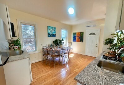 207 Princeton Street, Unit 2 Boston, MA 02128 - Photo 2 of 12 a living room with furniture and a couch