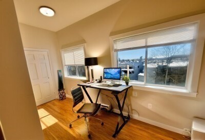 207 Princeton Street, Unit 2 Boston, MA 02128 - Photo 4 of 12 a workspace with furniture and a window