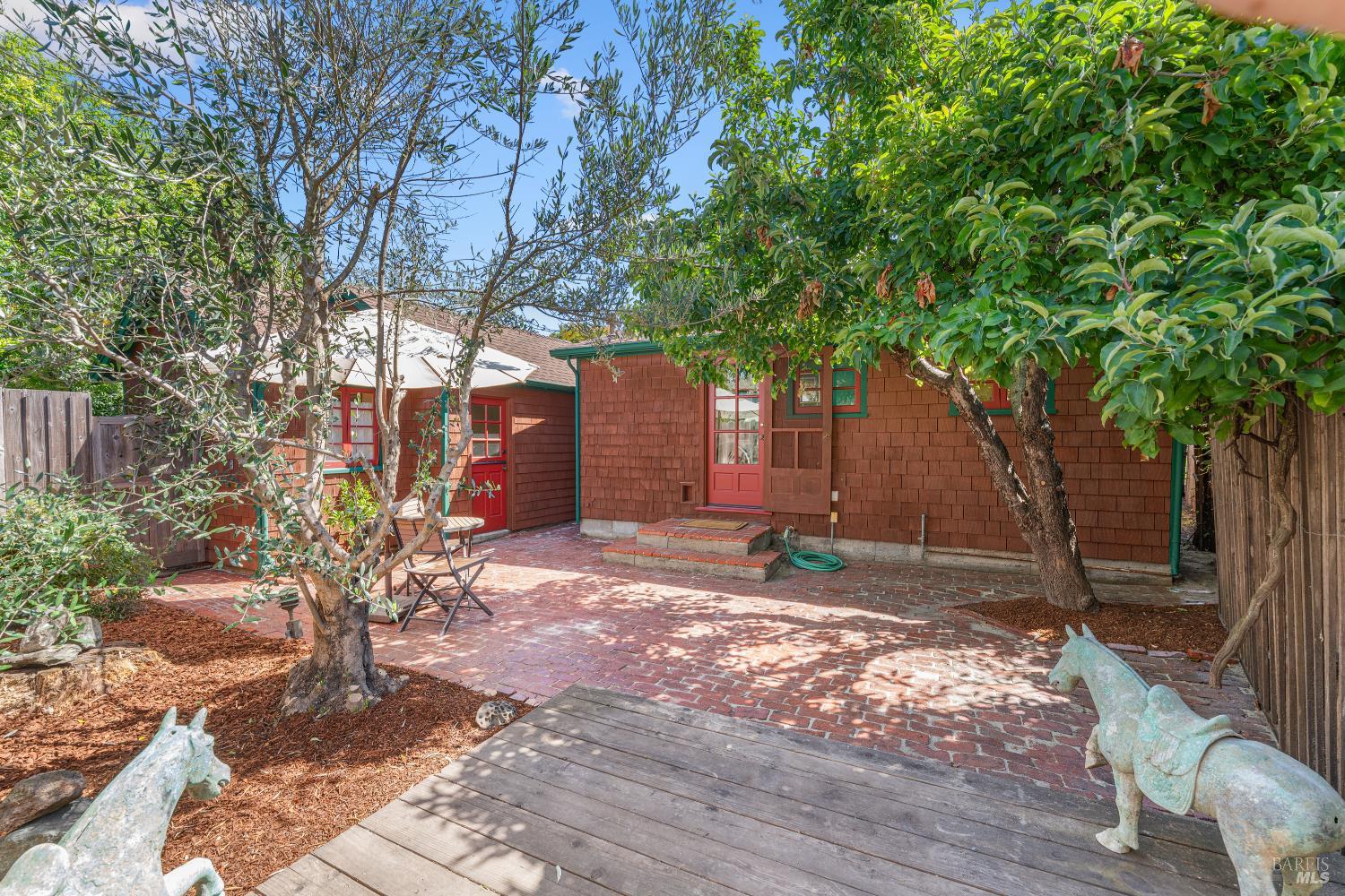 309 Hendley Street Santa Rosa, CA 95404 - Photo 12 of 31 a backyard of a house with table and chairs
