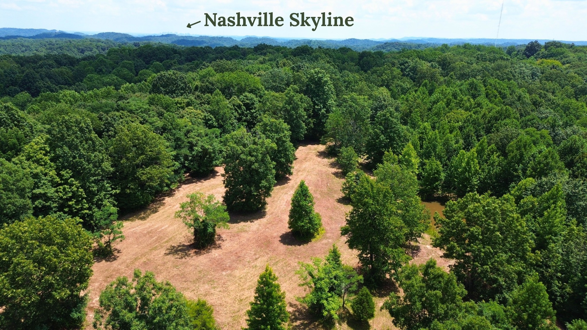 8218 Old Pond Creek Road Nashville, TN 37143 - Photo 13 of 23 a view of a lake with huge green field and trees all around