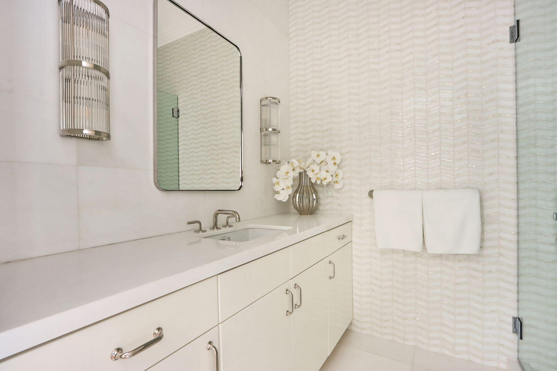 215 Indian Road Palm Beach, FL 33480 - Photo 17 of 33 a bathroom with a sink and a mirror