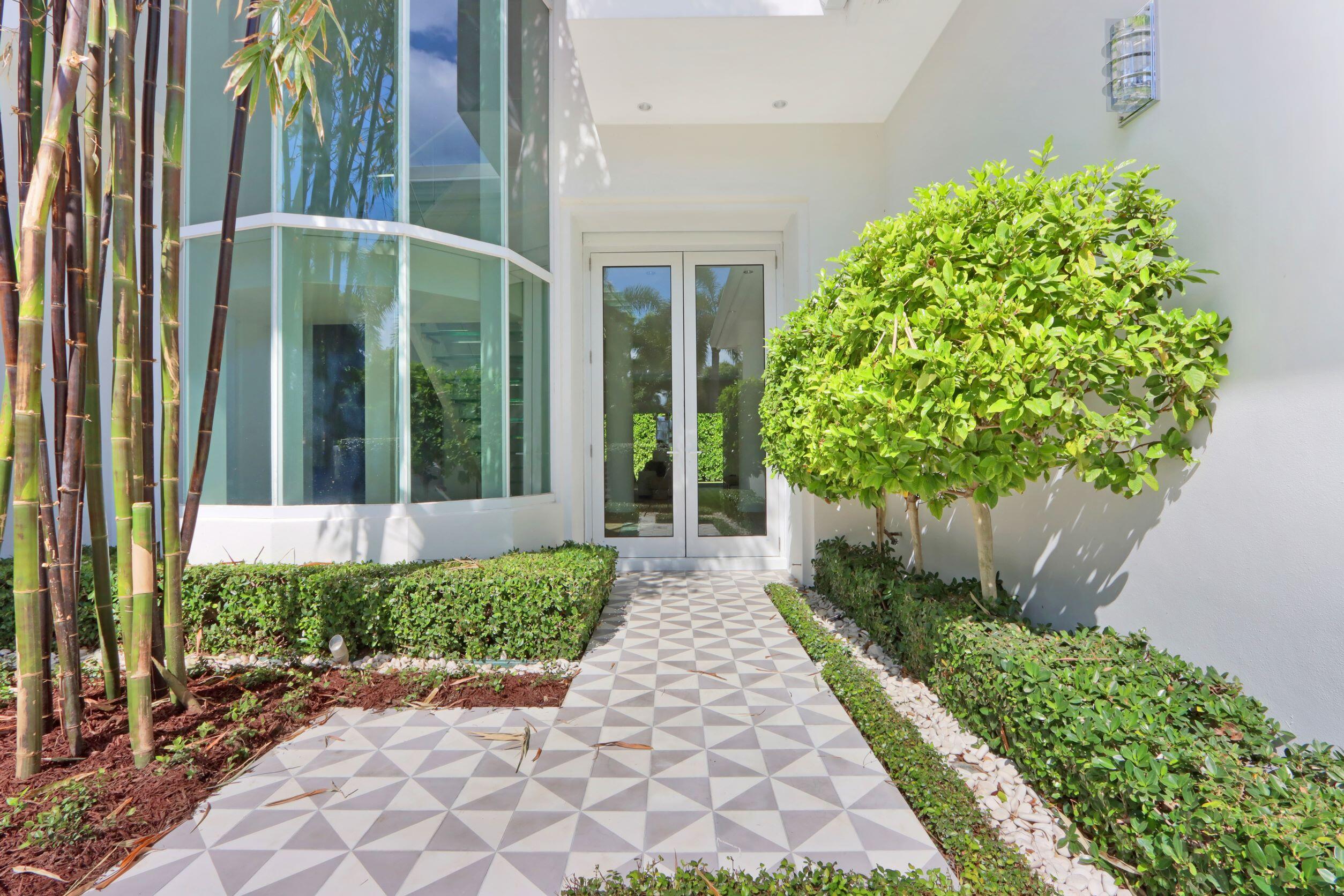215 Indian Road Palm Beach, FL 33480 - Photo 2 of 33 a view of a garden with pathway