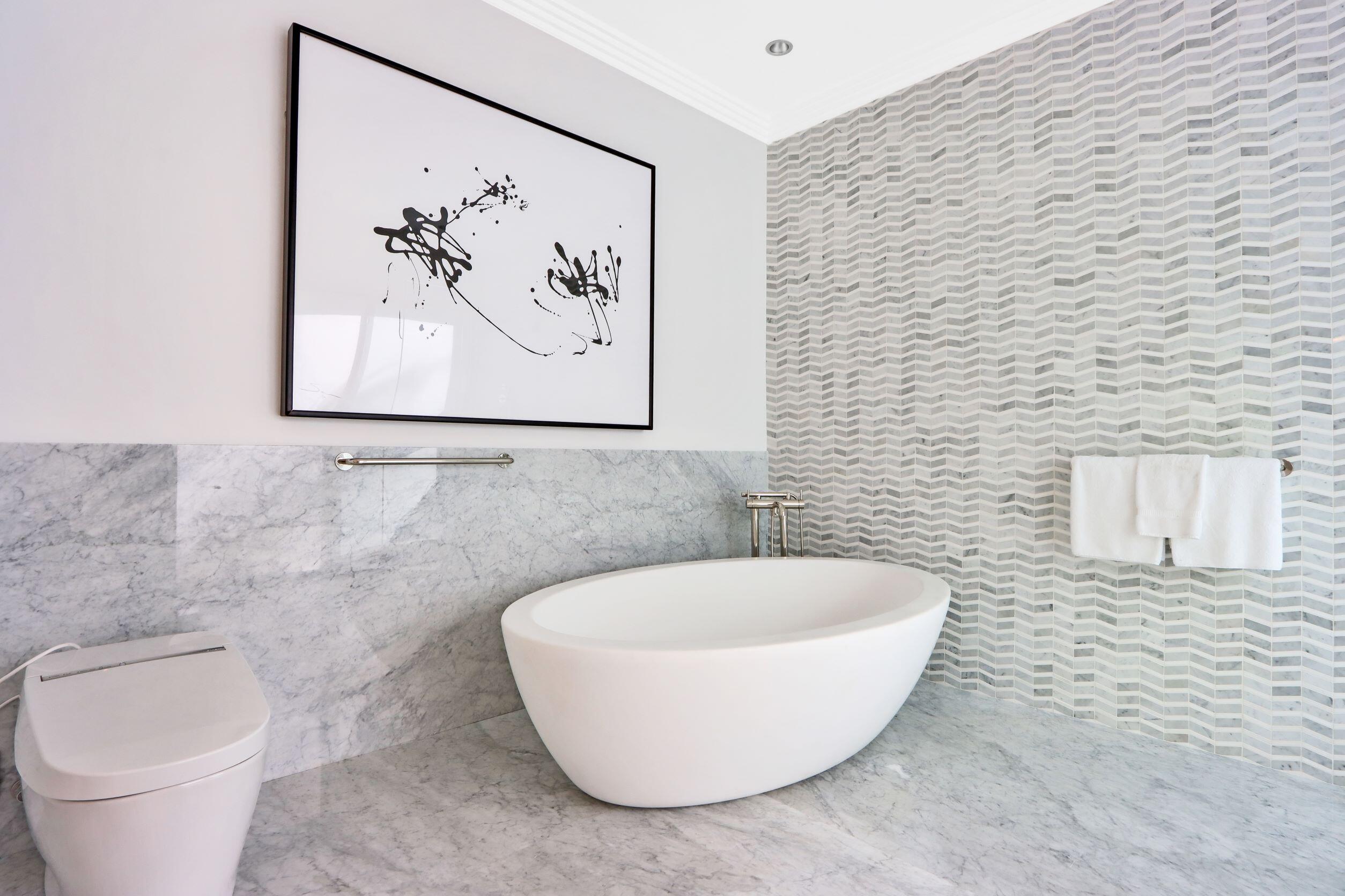 215 Indian Road Palm Beach, FL 33480 - Photo 22 of 33 a white tub sitting next to a white toilet