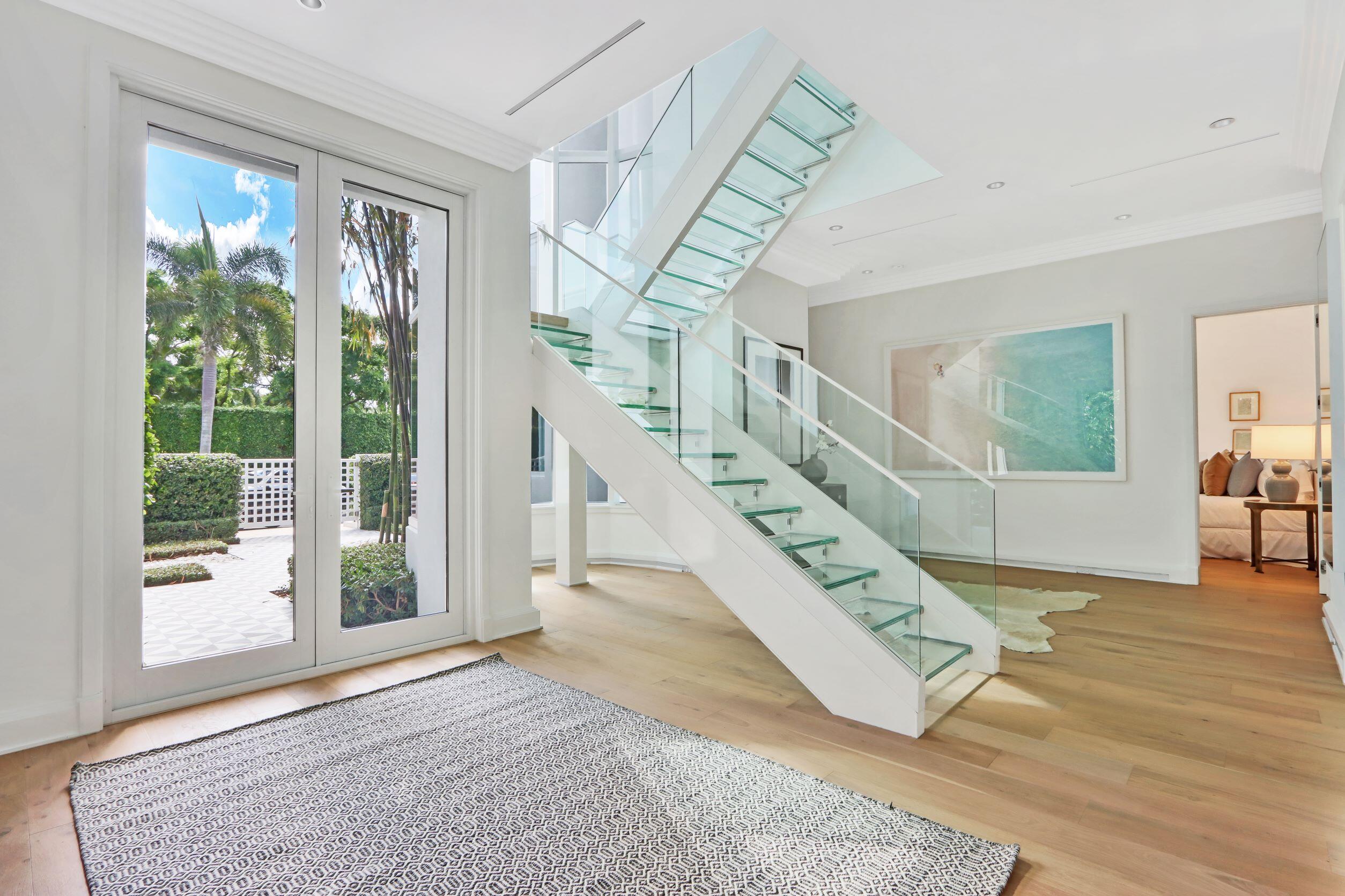 215 Indian Road Palm Beach, FL 33480 - Photo 26 of 33 a view of entryway and hall with wooden floor