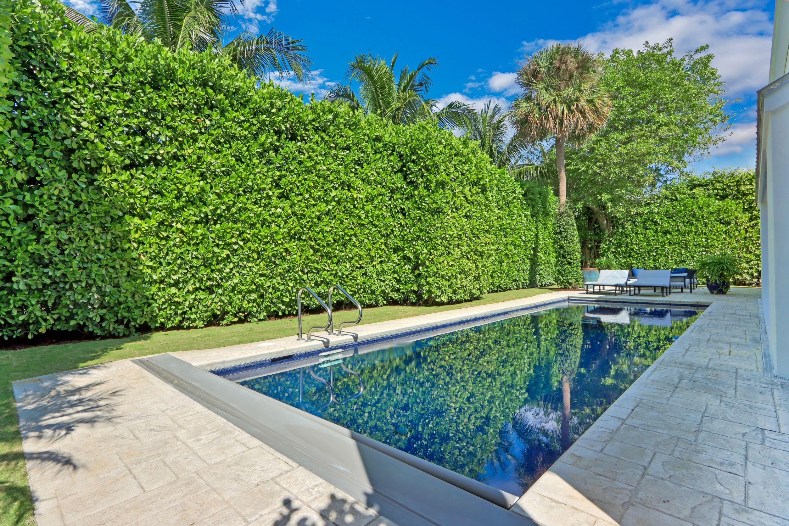 215 Indian Road Palm Beach, FL 33480 - Photo 29 of 33 a view of a swimming pool with a patio