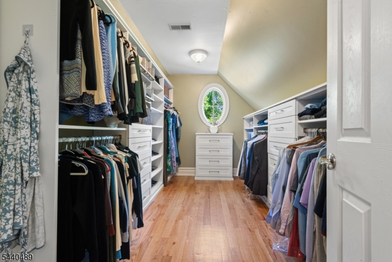 99 East Lindsley Road Cedar Grove, NJ 07009 - Photo 25 of 41 a view of walk in closet with clothes and shoes