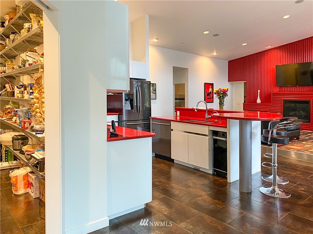 1333 Roy Road Bellingham, WA 98229 - Photo 20 of 37 a kitchen that has a lot of cabinets and wooden floor