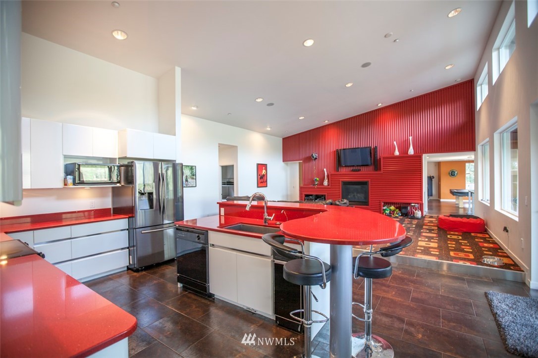 1333 Roy Road Bellingham, WA 98229 - Photo 22 of 37 a kitchen with stainless steel appliances kitchen island granite countertop a sink and cabinets