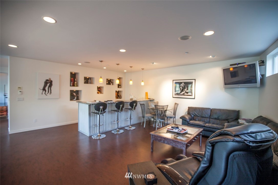 1333 Roy Road Bellingham, WA 98229 - Photo 25 of 37 a living room with furniture and a flat screen tv