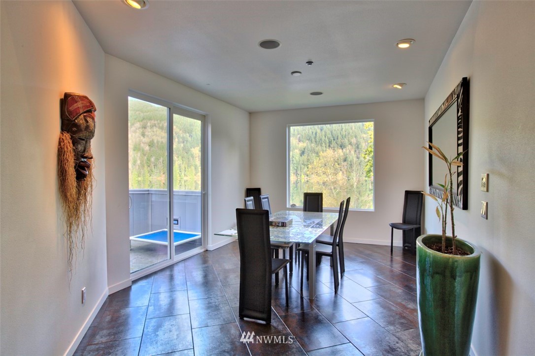 1333 Roy Road Bellingham, WA 98229 - Photo 28 of 37 a view of a dining room with furniture window and wooden floor