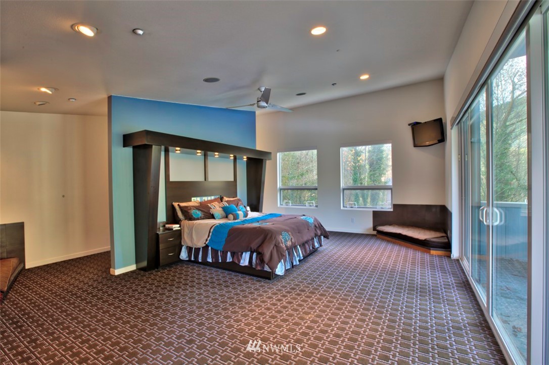 1333 Roy Road Bellingham, WA 98229 - Photo 29 of 37 a bedroom with furniture and large windows