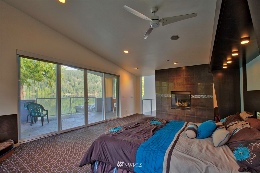 1333 Roy Road Bellingham, WA 98229 - Photo 31 of 37 a bedroom with a bed and a flat tv screen next to a window