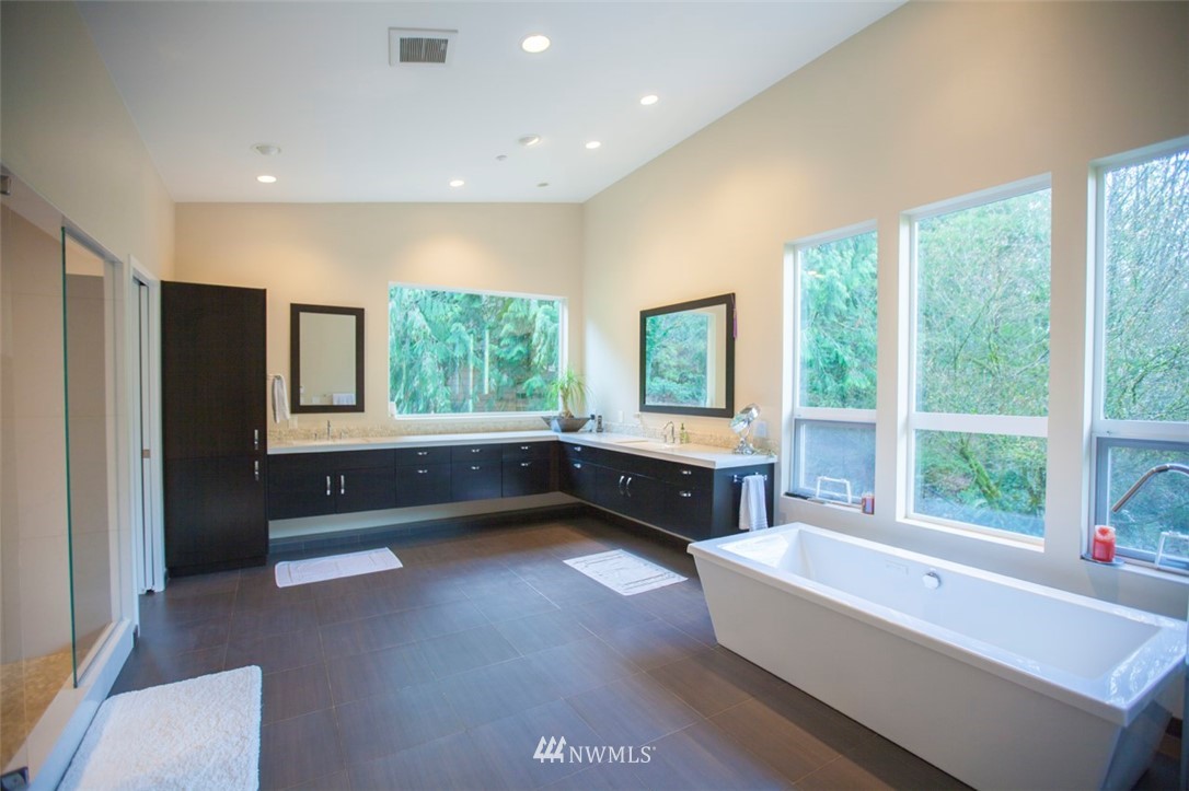 1333 Roy Road Bellingham, WA 98229 - Photo 34 of 37 a bathroom with a tub a sink and a window