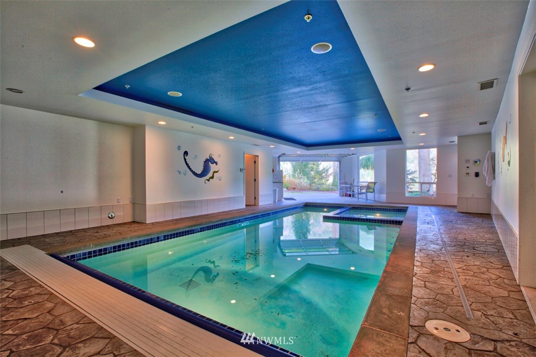 1333 Roy Road Bellingham, WA 98229 - Photo 10 of 37 a kitchen with stainless steel appliances granite countertop a sink and a white cabinets