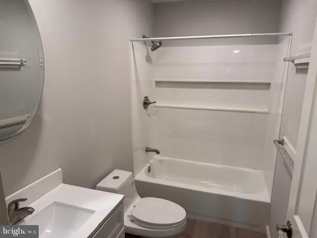 a bathroom with a toilet and a bathtub