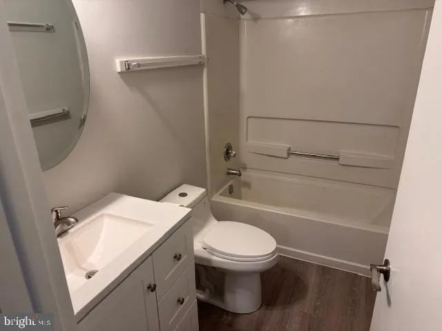 a kitchen with granite countertop a refrigerator stove top oven and sink