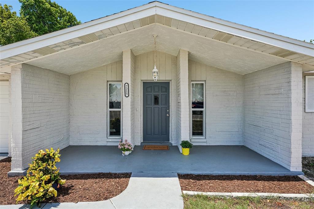 7215 Mayfield Drive Port Richey, FL 34668 - Photo 1 of 52 a front view of a house