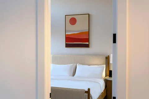 a bathroom with a sink vanity mirror and shower