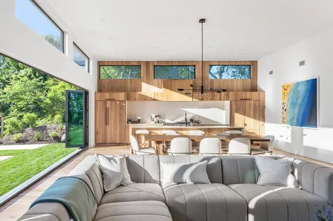 an outdoor living room with furniture