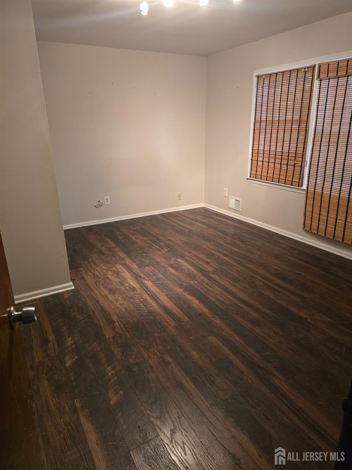 241 Monmouth Road Freehold, NJ 07728 - Photo 28 of 30 a view of a room with wooden floor and staircase