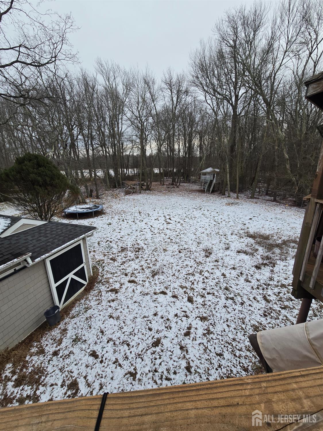 241 Monmouth Road Freehold, NJ 07728 - Photo 30 of 30 a view of a backyard with table and chairs