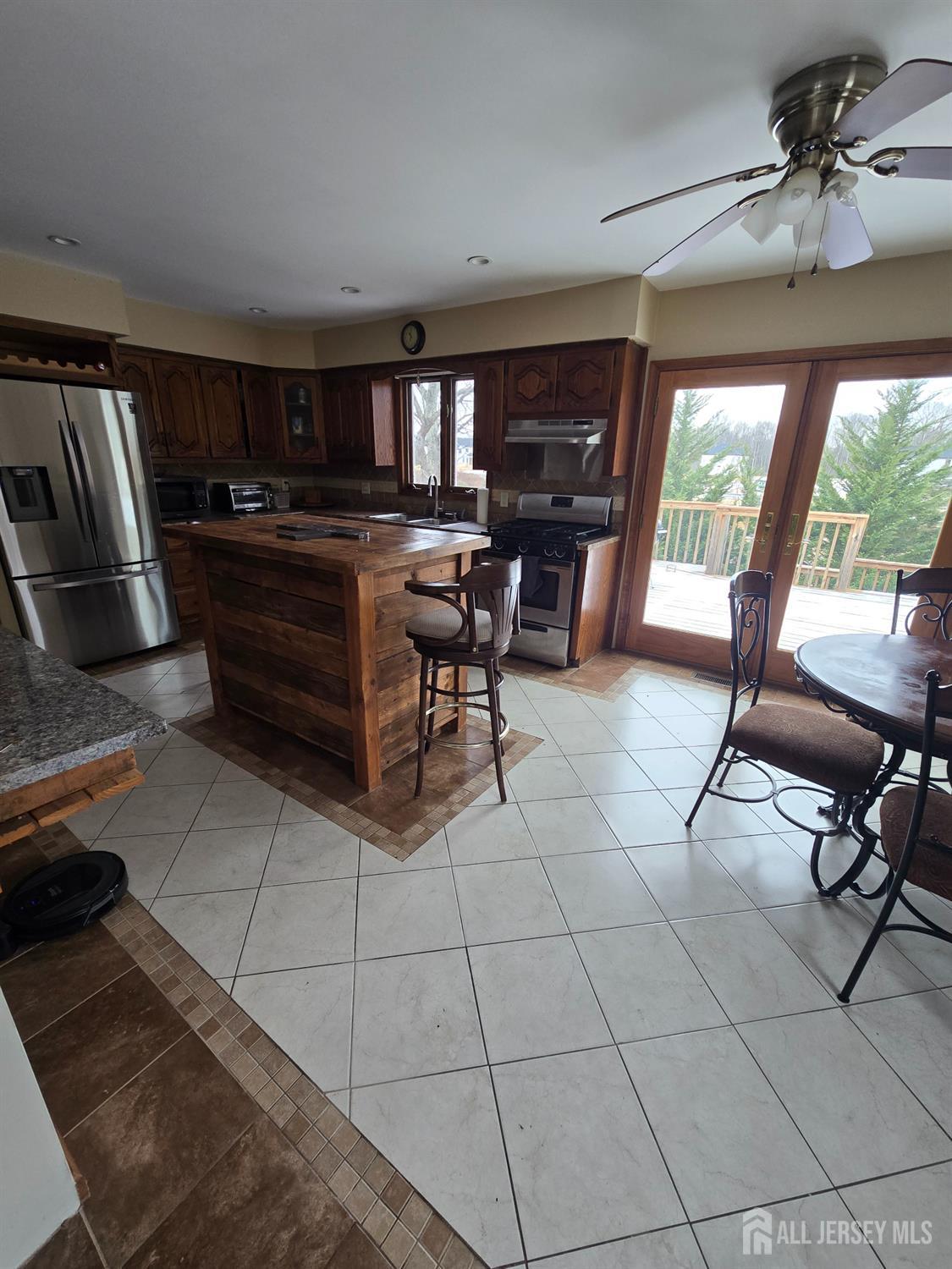 241 Monmouth Road Freehold, NJ 07728 - Photo 8 of 30 a outdoor space with lots of chairs and mirrors