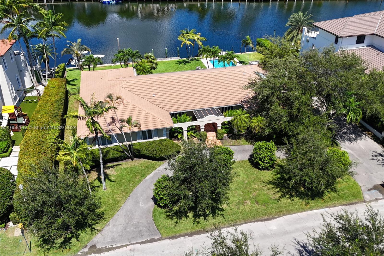 535 Solano Prado Coral Gables, FL 33156 - Photo 2 of 4 an aerial view of a house with a lake view