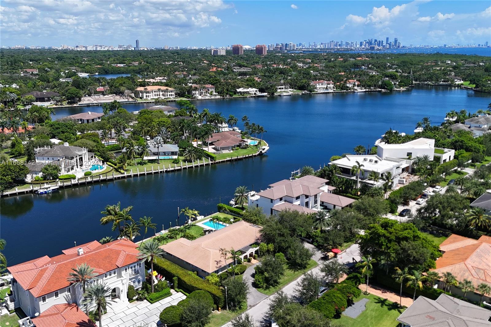 535 Solano Prado Coral Gables, FL 33156 - Photo 4 of 4 an aerial view of residential houses with outdoor space and lake view