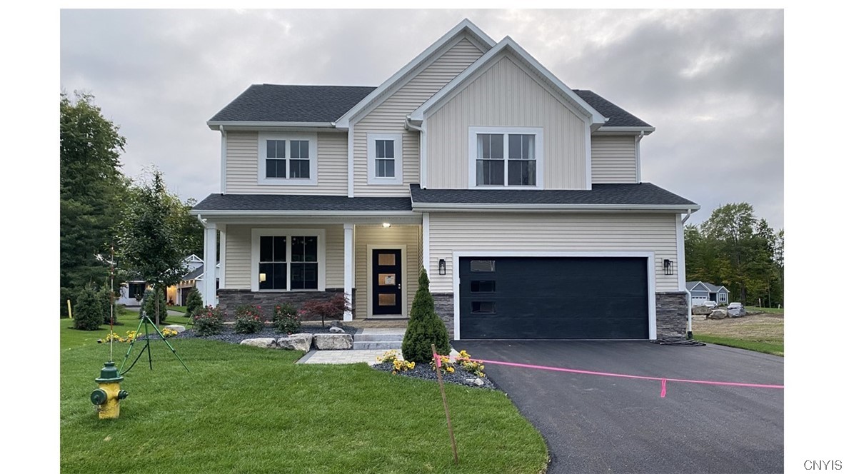 8901 Tulip Tree Path Lysander, NY 13027 - Photo 1 of 50 Front - professionally landscaped and hardscaped.