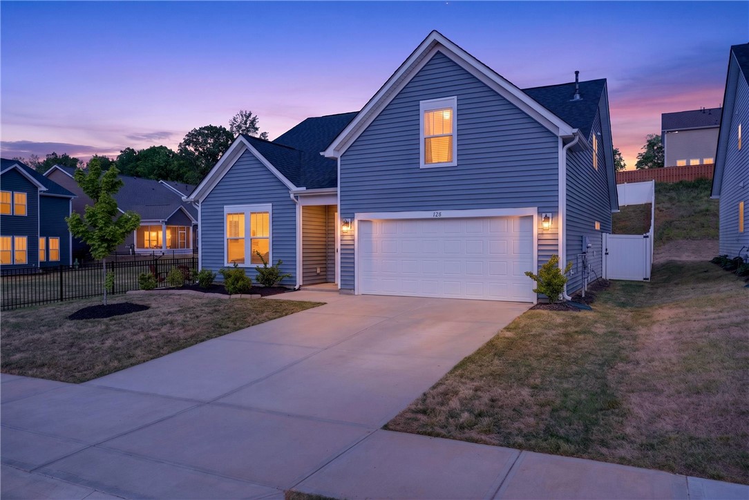 128 Whitman Way Easley, SC 29642 - Photo 33 of 34 This charming home features a well-maintained exterior, a spacious driveway, and a two-car garage.