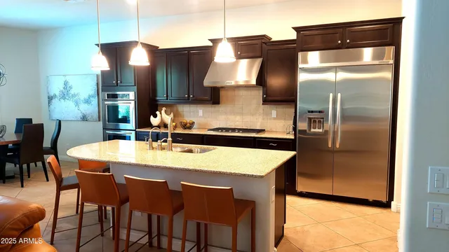a view of a patio with a table and chairs