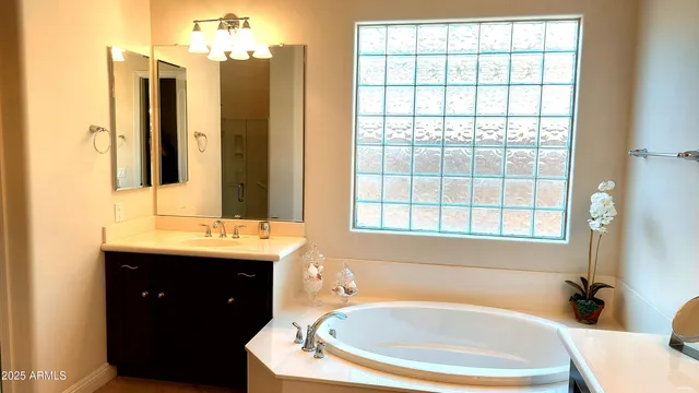 a large kitchen with stainless steel appliances kitchen island granite countertop a table and chairs