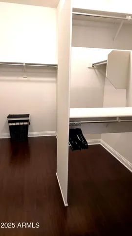 a bedroom with furniture and windows