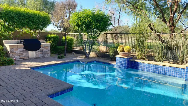 a view of a swimming pool with a patio