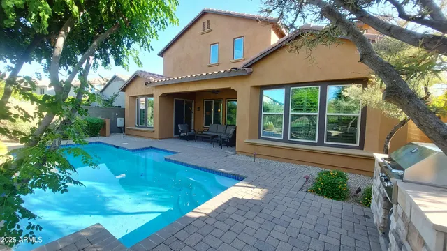 a view of swimming pool with seating space