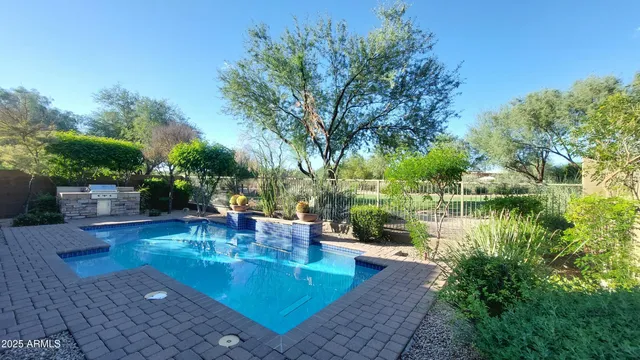 a living room with furniture and a large tree