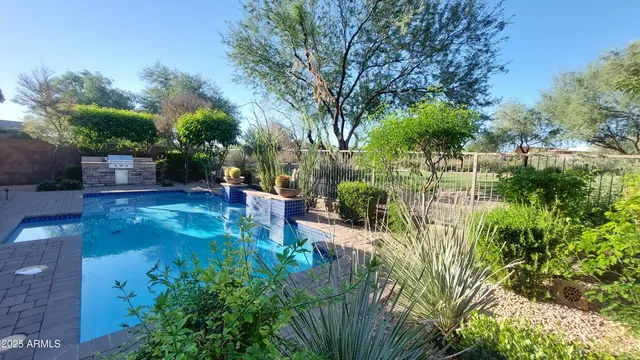 a view of a swimming pool with a patio