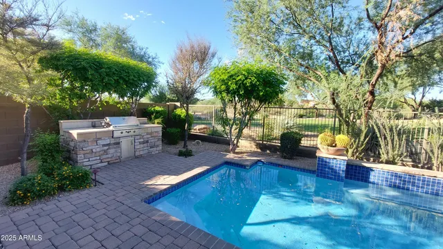 a view of a swimming pool with lounge chair