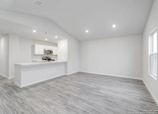 a view of kitchen with wooden floor